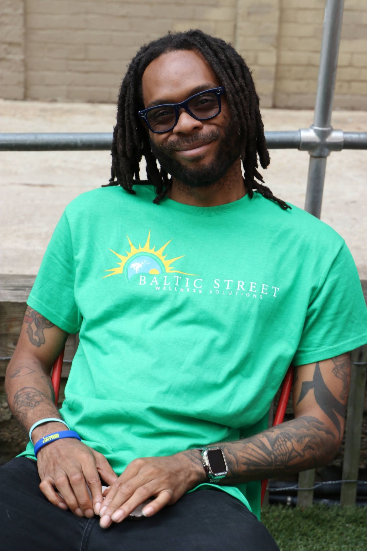 A Baltic Street team member in a green T-shirt